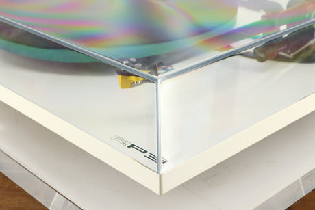 Front right corner of a used Rega RP3 / Exact Cartridge in a white finish