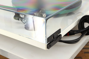 Rear right corner of a used Rega RP3 / Exact Cartridge in a white finish