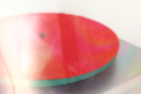 Close up of a used Rega RP40 Anniversary Edition Turntable / Exact Cartridge in a titanium finish showing scratching on lid