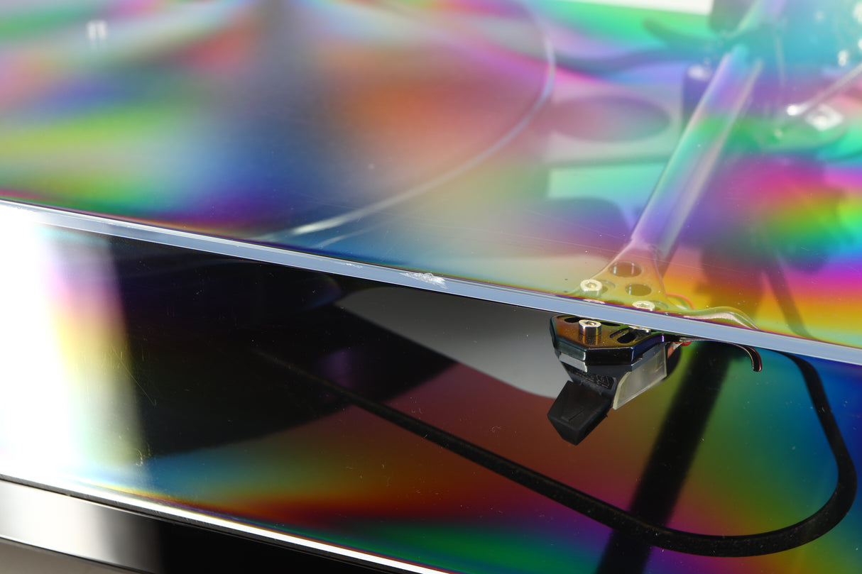 Close up of a used Rega RP8 Turntable / Apheta 2 MC Cartridge in a black finish showing nick on front edge of lid