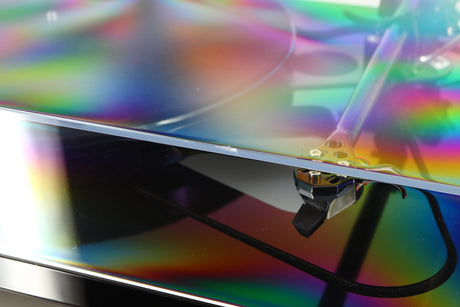 Close up of a used Rega RP8 Turntable / Apheta 2 MC Cartridge in a black finish showing nick on front edge of lid
