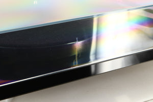 Close up view of a used Rega RP8 Turntable in Black finish showing scratch on the front of the lid