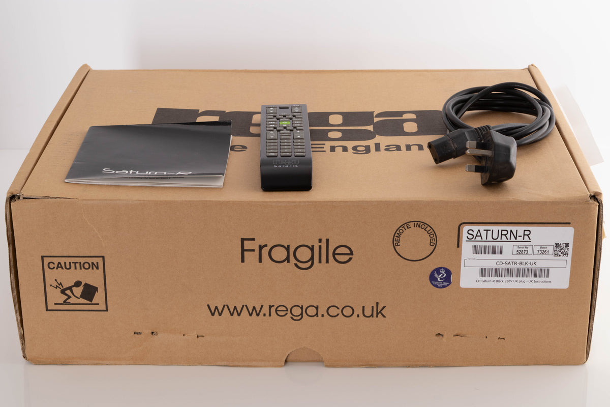 Box of a used Rega Saturn-R CD Player with mains cable, manual, and remote 