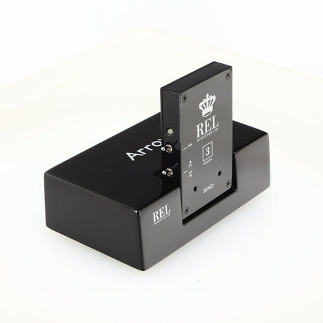 Front left corner of a used REL Arrow V3 Wireless Subwoofer Transmitter in a black finish