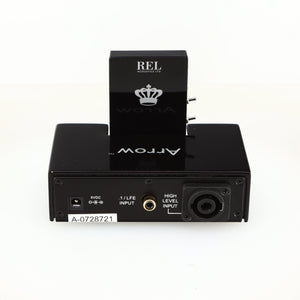 Rear view of a used REL Arrow V3 Wireless Subwoofer Transmitter in a black finish showing Phono Input, Power Input and Hi-Level Input