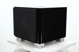 Front right corner of a used REL T-7X Subwoofer in a piano black finish