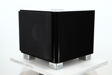 Front right corner of a used REL T-7X Subwoofer in a piano black finish