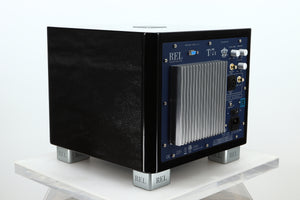 Rear right corner of a used REL T-7X Subwoofer in a piano black finish