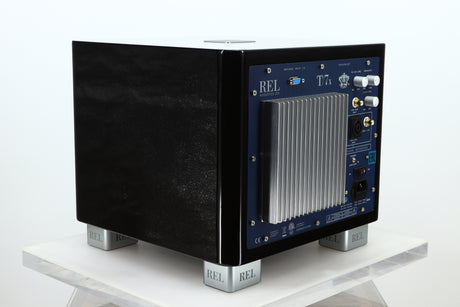 Rear right corner of a used REL T-7X Subwoofer in a piano black finish