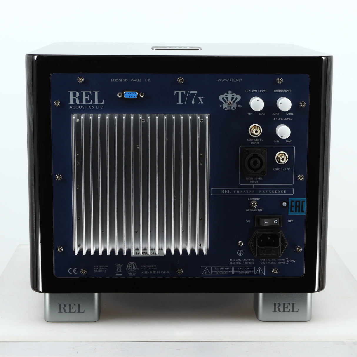 Rear view of a used REL T-7X Subwoofer in a piano black finish showing Mains Input and Hi-Level Input