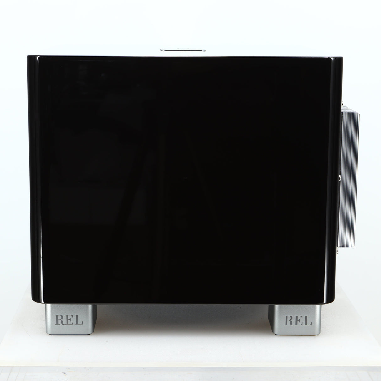 Right side view of a used REL T-7X Subwoofer in a piano black finish
