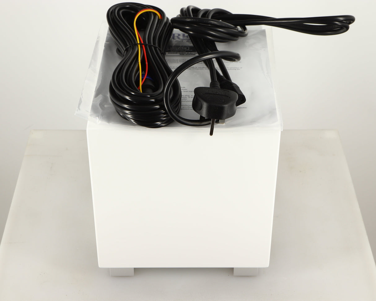 Top of a used REL T-Zero MKIII Subwoofer in a piano white finish showing Hi-Level Cable, Mains Cable and Manual