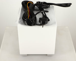 Top of a used REL T-Zero MKIII Subwoofer in a piano white finish showing Hi-Level Cable, Mains Cable and Manual