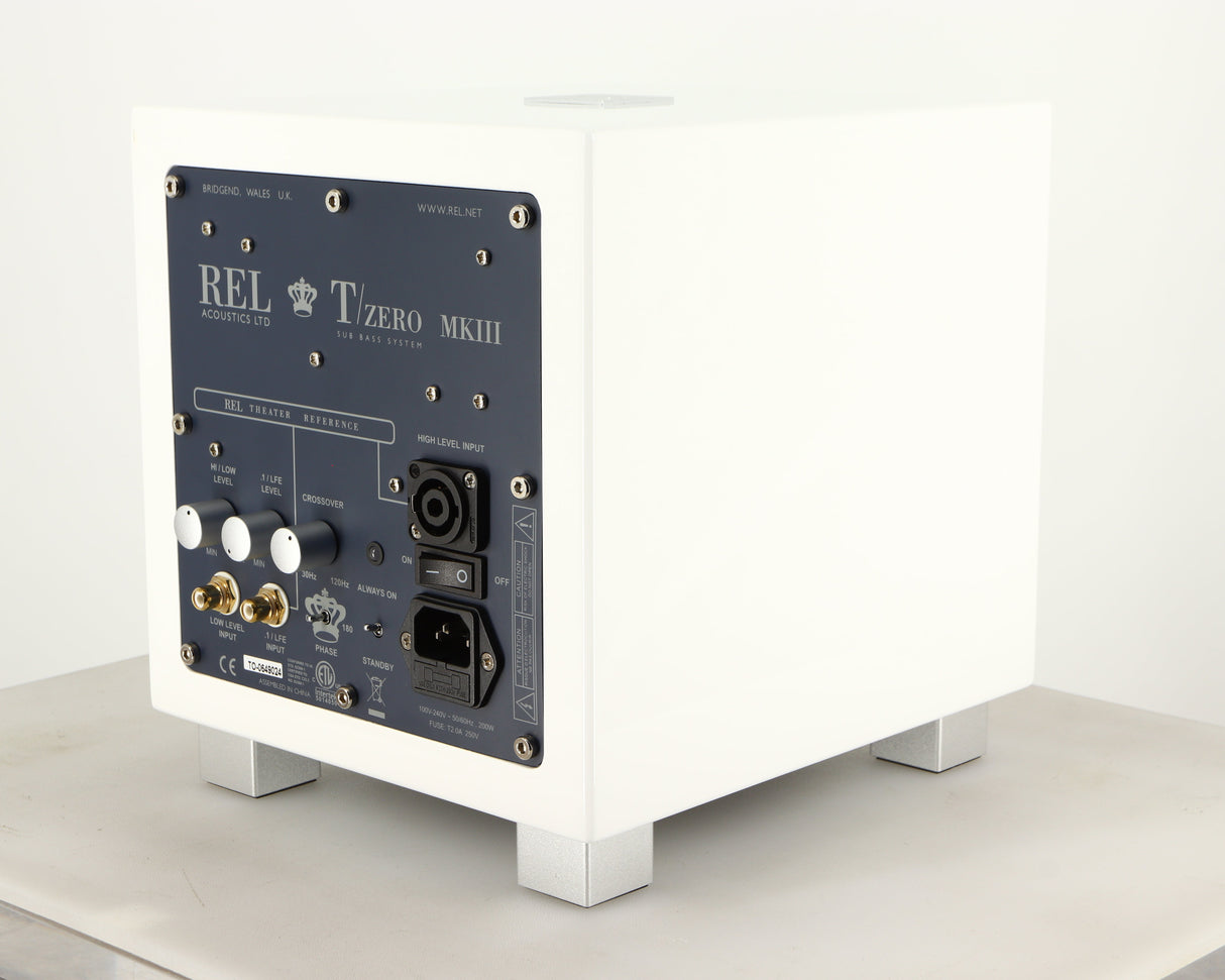 Rear left corner of a used REL T-Zero MKIII Subwoofer in a piano white finish