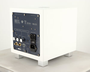 Rear left corner of a used REL T-Zero MKIII Subwoofer in a piano white finish