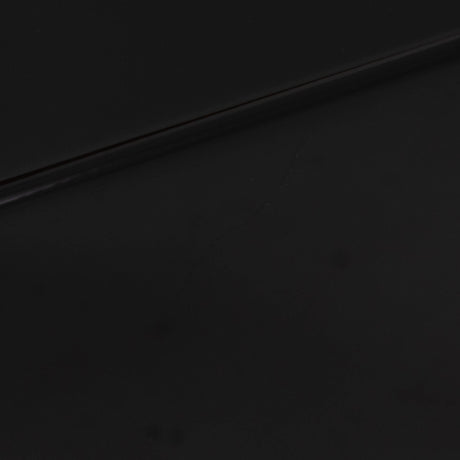 Close up of a used REL T-Zero Subwoofer in a Piano Black finish showing scratch on left side