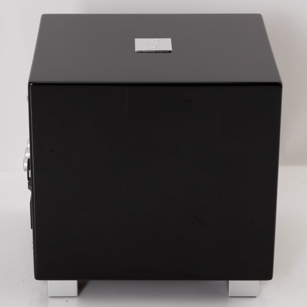 Left side view of a used REL T-Zero Subwoofer in a Piano Black finish