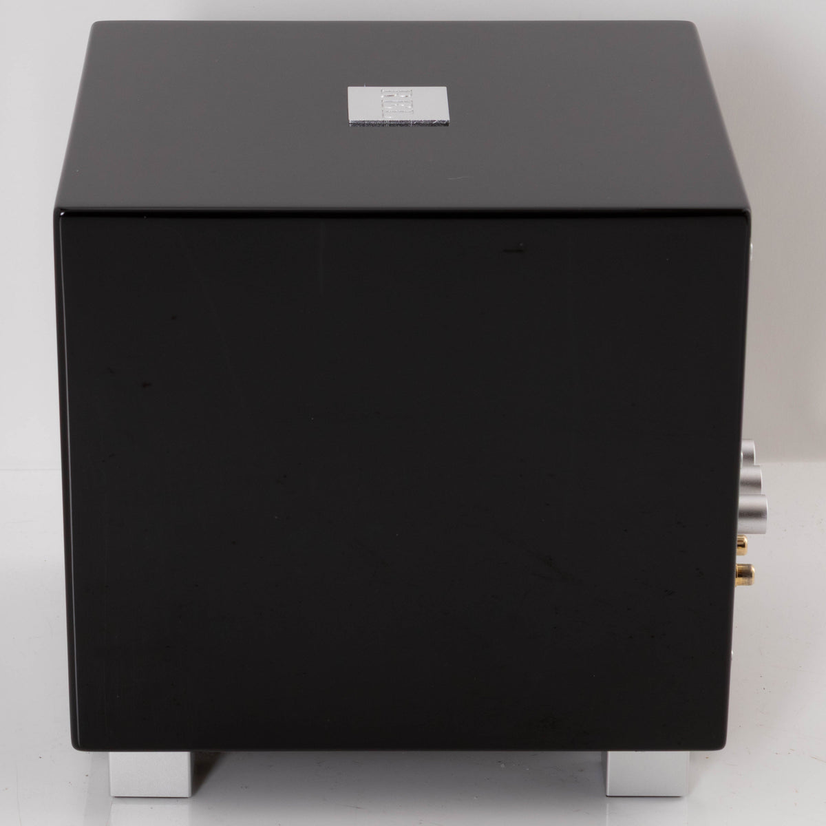 Right side view of a used REL T-Zero Subwoofer in a Piano Black finish
