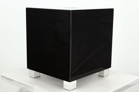 Front right corner of a REL T5i Subwoofer with a piano black finish
