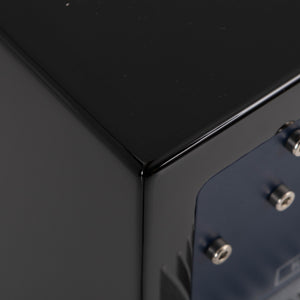 Rear right corner of a used REL T5i Subwoofer in a Piano Black finish