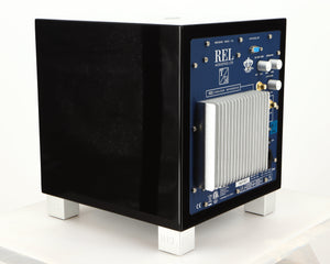 Rear right corner of a used REL T5i Subwoofer in a piano black finish