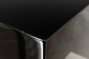 Close up view of a used REL T5i Subwoofer in Piano Black finish with Upgrade Feet