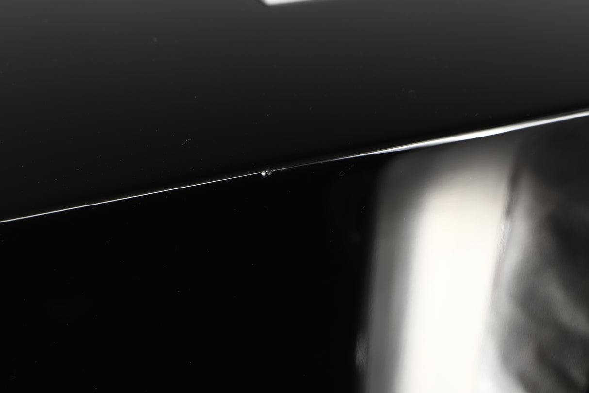 Close up view of a used REL T5i Subwoofer in Piano Black finish with Upgrade Feet