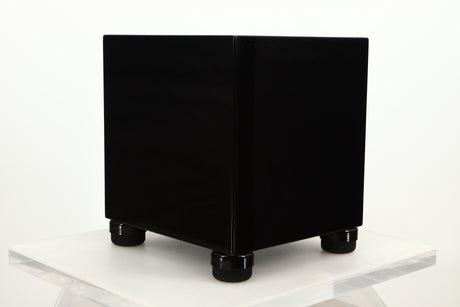Front left corner view of a used REL T5i Subwoofer in Piano Black finish with Upgrade Feet