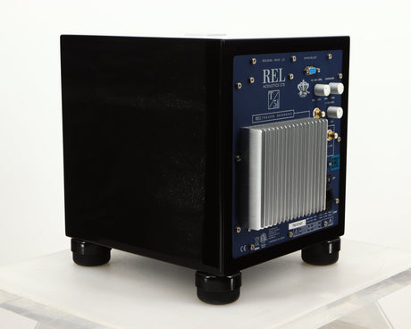 Rear right corner of a used REL T5i Subwoofer W/ Upgraded Feet in a piano black finish