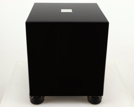 Top of a used REL T5i Subwoofer W/ Upgraded Feet in a piano black finish
