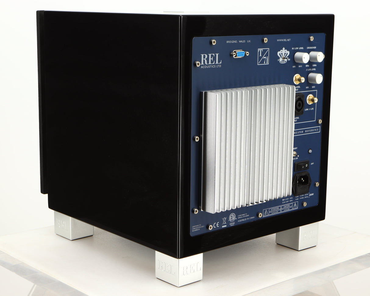 Rear right corner of a used REL T7i Subwoofer in a piano black finish