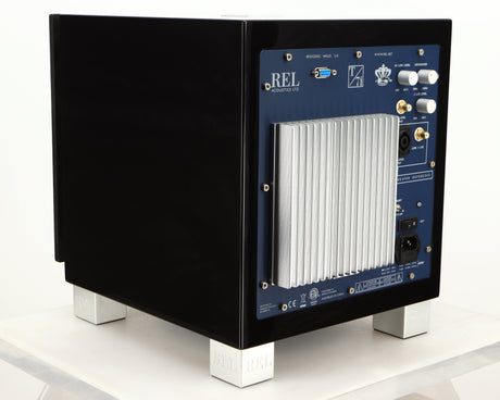 Rear right corner of a used REL T7i Subwoofer in a piano black finish