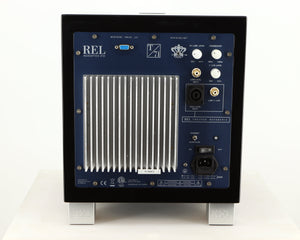 Rear view of a used REL T7i Subwoofer in a piano black finish showing Mains Input and High Level Input