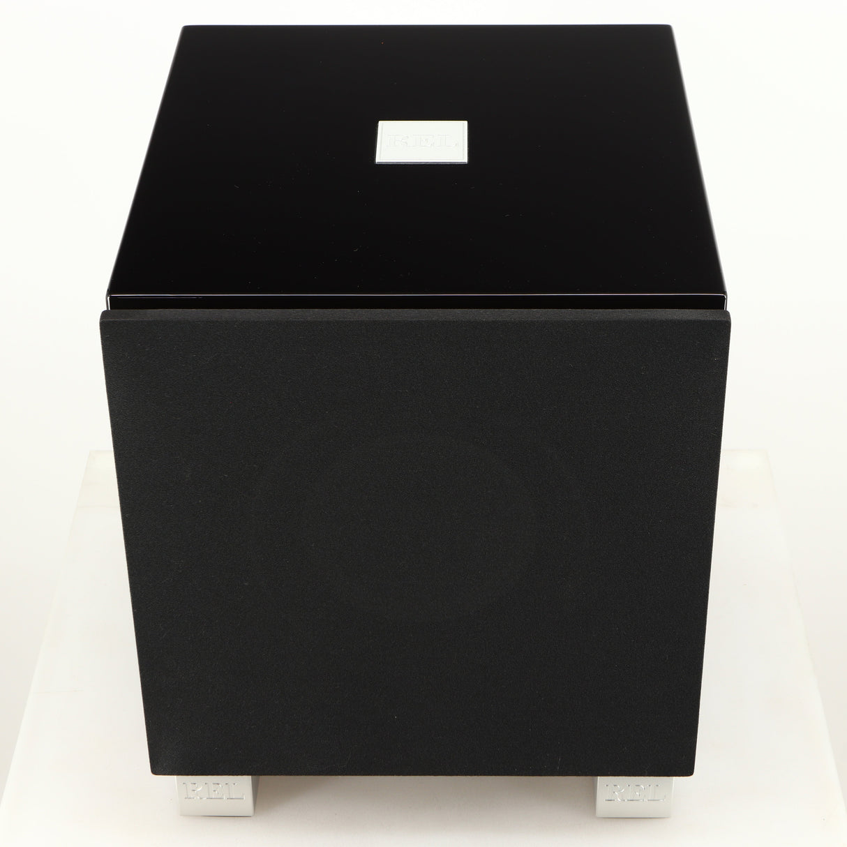 Top of a used REL T7i Subwoofer in a piano black finish