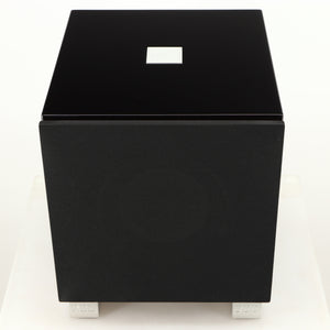Top of a used REL T7i Subwoofer in a piano black finish