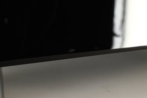 Close up view of a used REL T5X Subwoofer in Piano Black finish