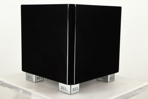 Front right corner view of a used REL T5X Subwoofer in Piano Black finish