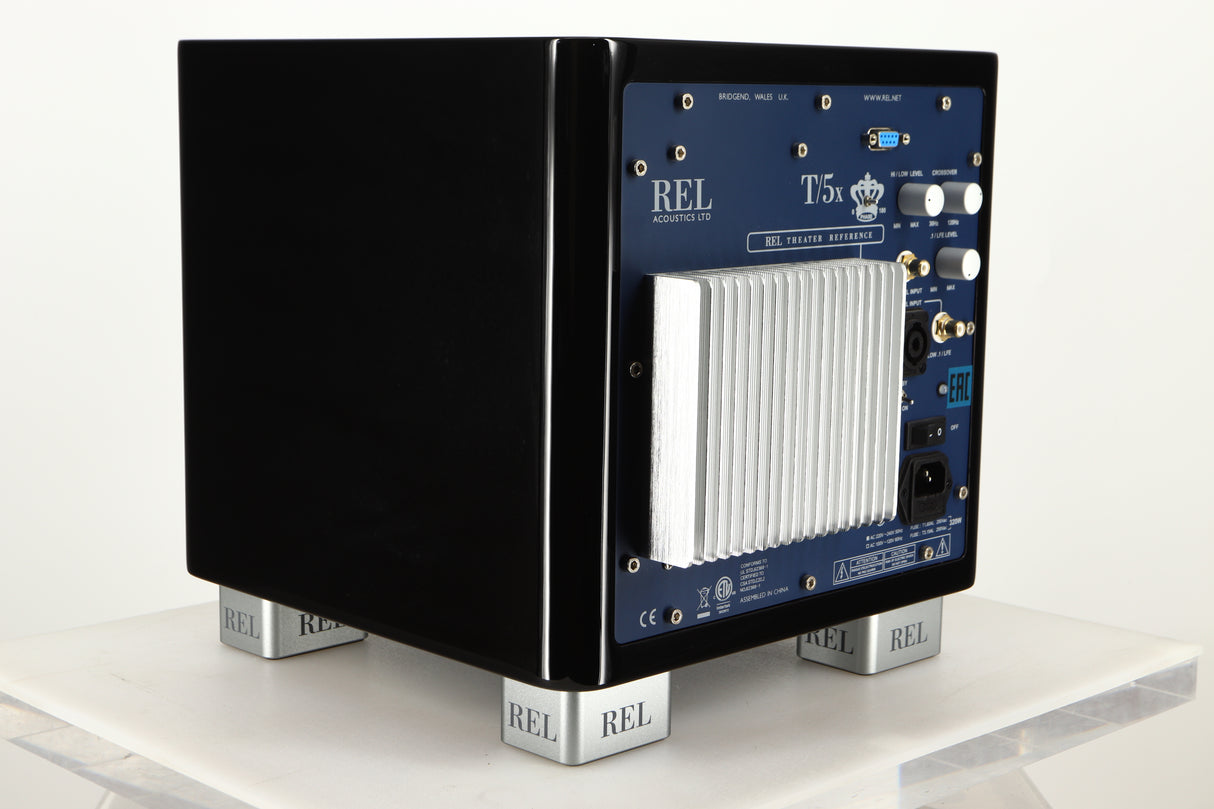 Rear left corner view of a used REL T5X Subwoofer in Piano Black finish