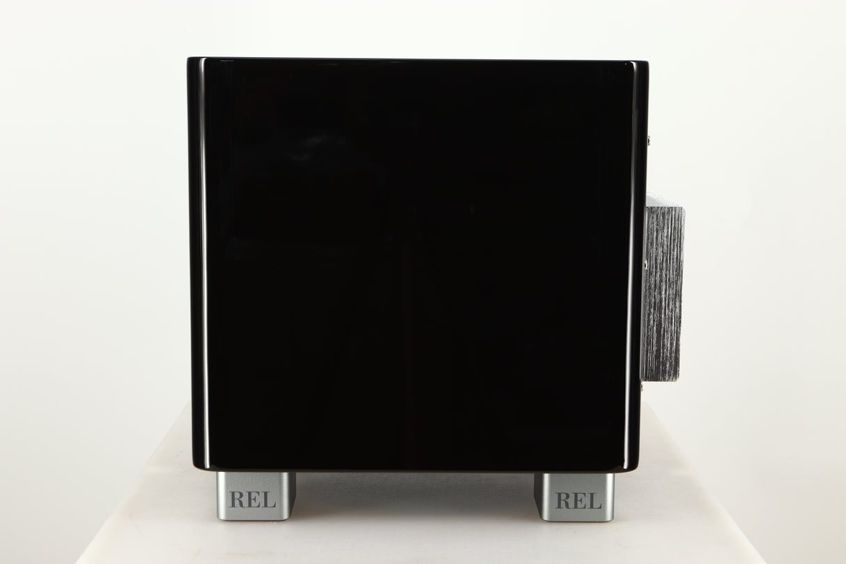 Side view of a used REL T5X Subwoofer in Piano Black finish