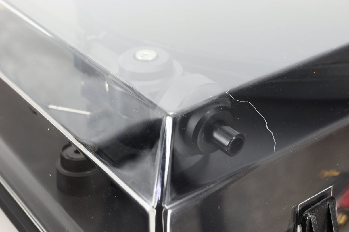 Close up of a used Revolver Rebel Turntable / AT95E Cartridge in a black finish showing some damage on the lid