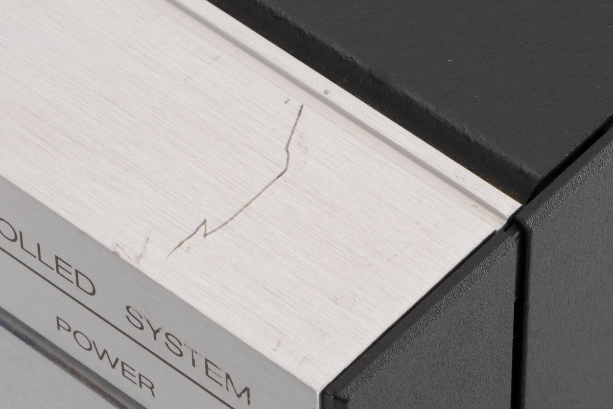 Close up of a used Revox B251 Integrated Amplifier showing scratch on top