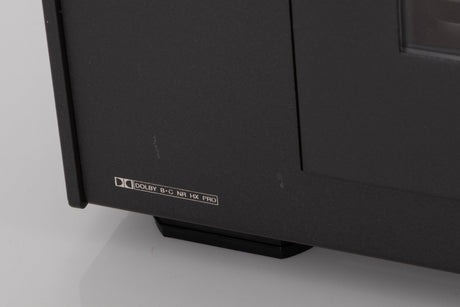 Close up of a used Revox C115 Cassette Tape Deck in a Black finish showing few light scratches on fascia