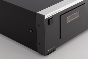 Front left corner of a used Revox C115 Cassette Tape Deck in a Black finish