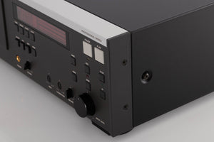 Front right corner of a used Revox C115 Cassette Tape Deck in a Black finish