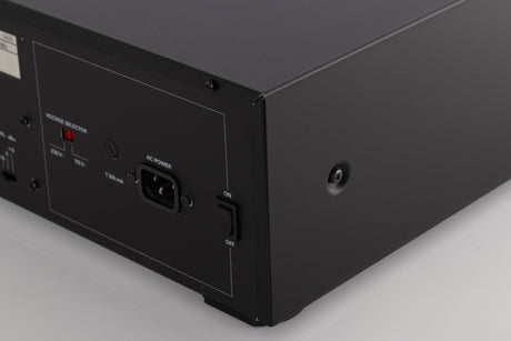 Rear left corner of a used Revox C115 Cassette Tape Deck in a Black finish