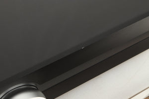 Close up view of a used Roksan Attessa Integrated Amplifier in Black finish showing a small chip on the front edge
