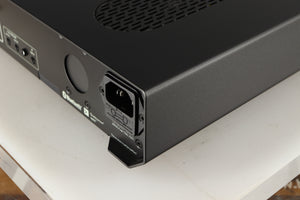 Rear left corner of a used Roksan Attessa Integrated Amplifier in a black finish