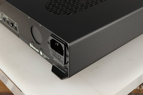 Rear left corner of a used Roksan Attessa Integrated Amplifier in a black finish