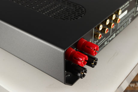Rear right corner of a used Roksan Attessa Integrated Amplifier in a black finish