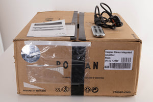 Box of a used Roksan Caspian M2 Integrated Amplifier in Black with mains cable, remote, and manual